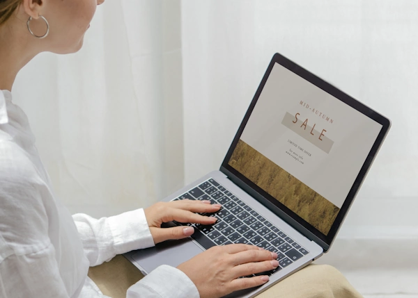 Laptop displaying a webpage using white space to craft a unique visual design